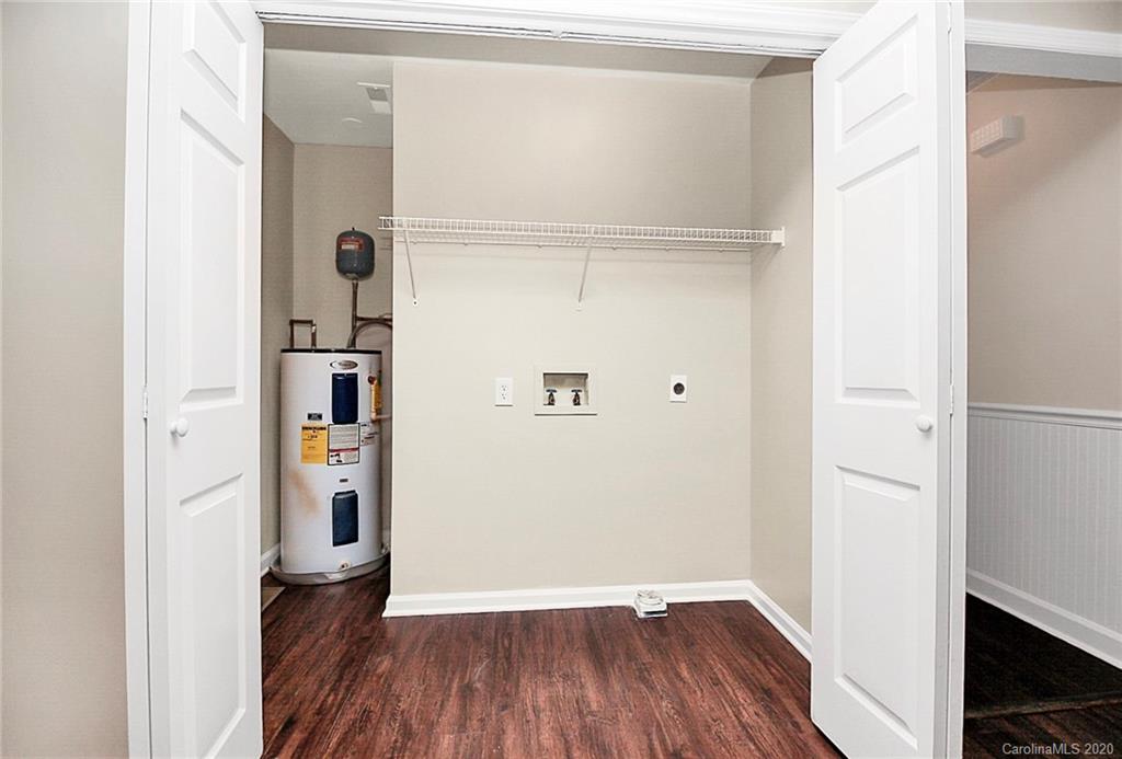 307 Harris Street Fort Mill, SC 29715 - Photo 15 of 39 a view of a hallway with wooden floor and closet