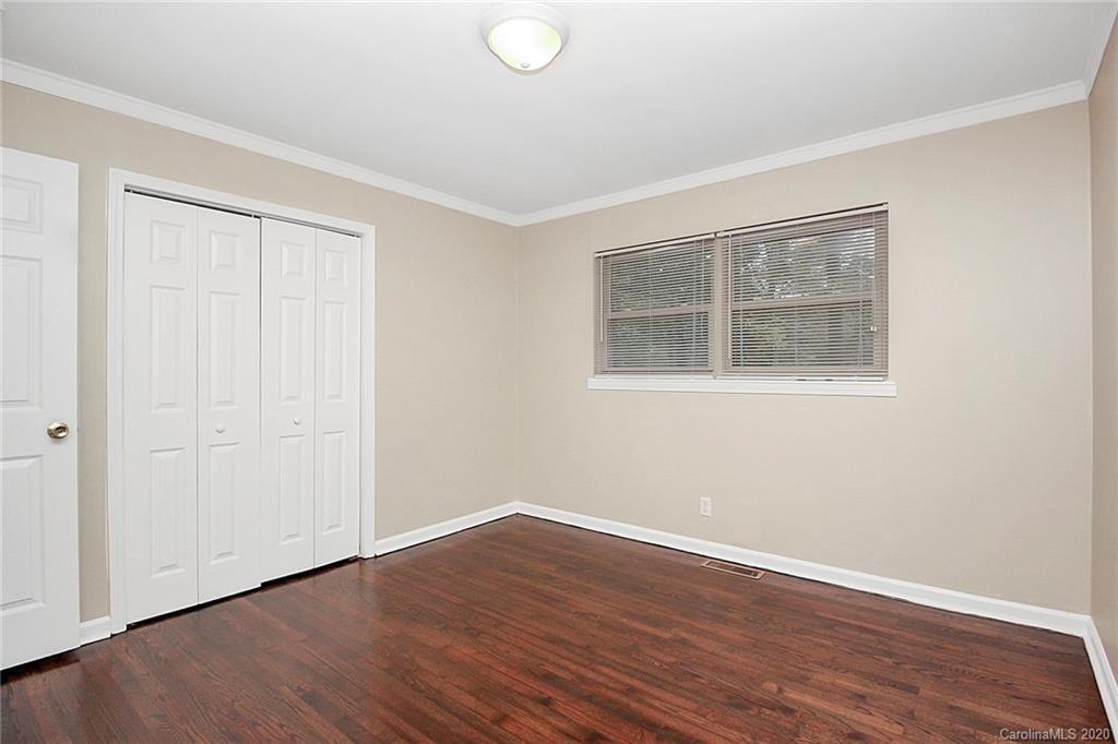307 Harris Street Fort Mill, SC 29715 - Photo 17 of 39 a view of an empty room with wooden floor and a window