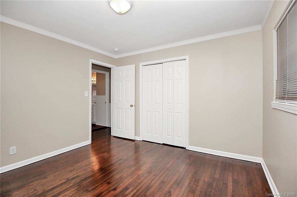 307 Harris Street Fort Mill, SC 29715 - Photo 18 of 39 a view of an empty room with wooden floor and a window