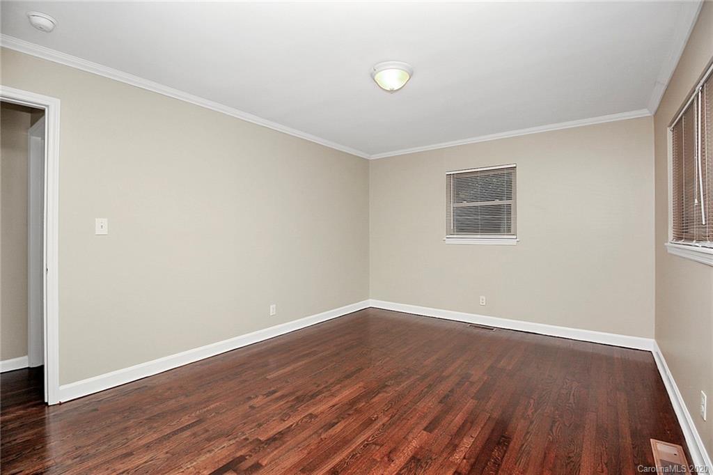 307 Harris Street Fort Mill, SC 29715 - Photo 20 of 39 an empty room with wooden floor and windows