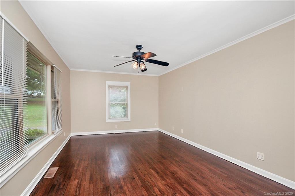 307 Harris Street Fort Mill, SC 29715 - Photo 3 of 39 a view of empty room with wooden floor and fan
