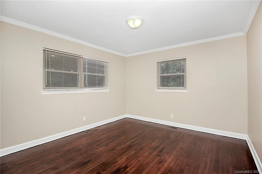 307 Harris Street Fort Mill, SC 29715 - Photo 23 of 39 a view of a room with wooden floor and windows