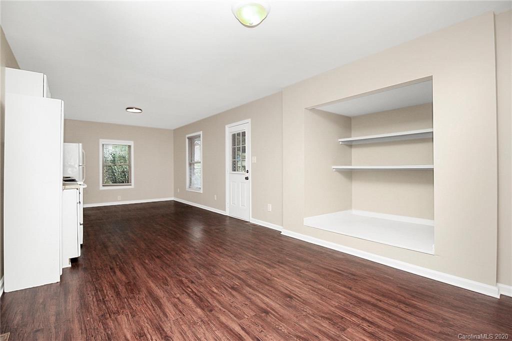 307 Harris Street Fort Mill, SC 29715 - Photo 28 of 39 a view of an empty room with window and wooden floor