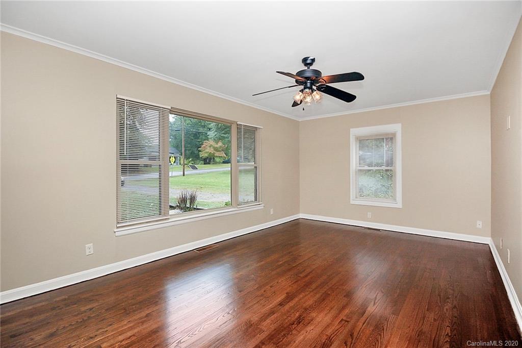307 Harris Street Fort Mill, SC 29715 - Photo 4 of 39 a view of a room with wooden floor and chandelier fan