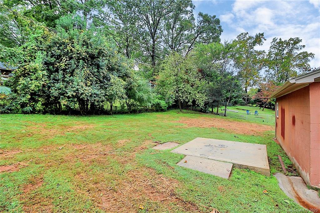 307 Harris Street Fort Mill, SC 29715 - Photo 32 of 39 a view of a backyard with a garden