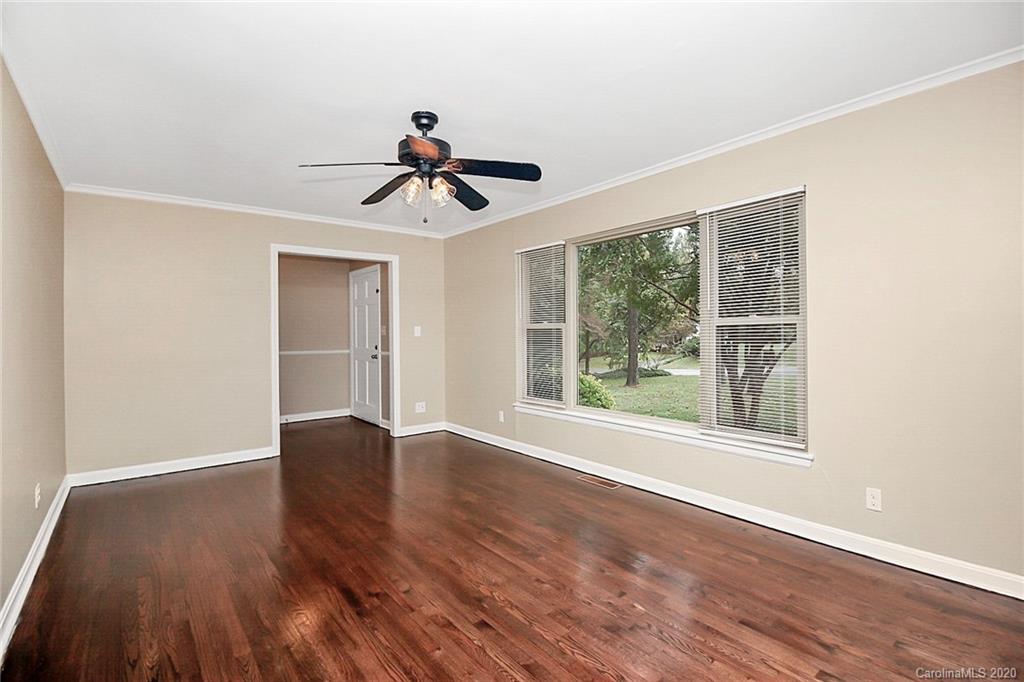 307 Harris Street Fort Mill, SC 29715 - Photo 5 of 39 a view of empty room with wooden floor and fan