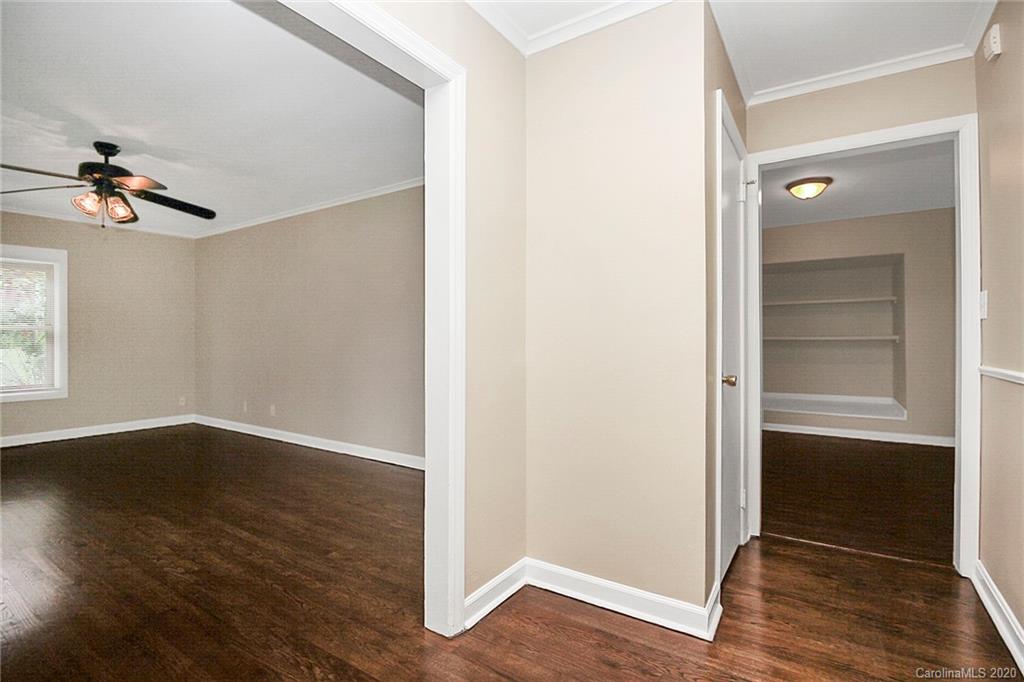 307 Harris Street Fort Mill, SC 29715 - Photo 6 of 39 an empty room with wooden floor cabinet and windows