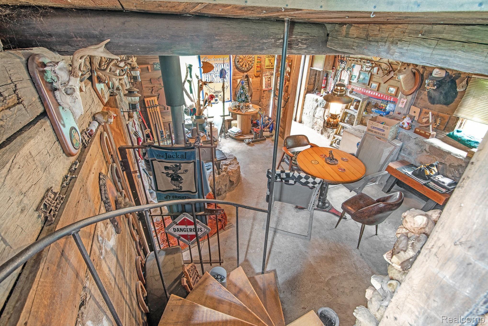 4682 North Eager Road Howell, MI 48855 - Photo 14 of 20 spiral staircase leading to finished space below the barn