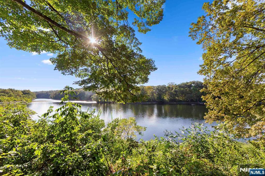 190 Highway 46, Unit B Little Ferry, NJ 07643 - Photo 15 of 20 a view of a lake with a house in the background