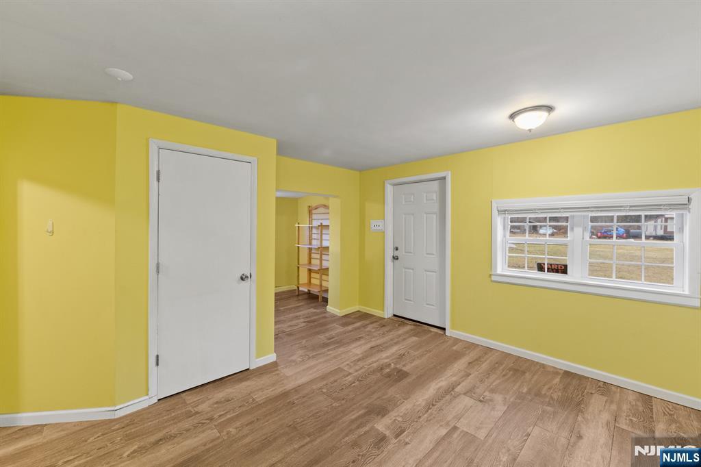 190 Highway 46, Unit B Little Ferry, NJ 07643 - Photo 3 of 20 a view of a room with wooden floor and windows