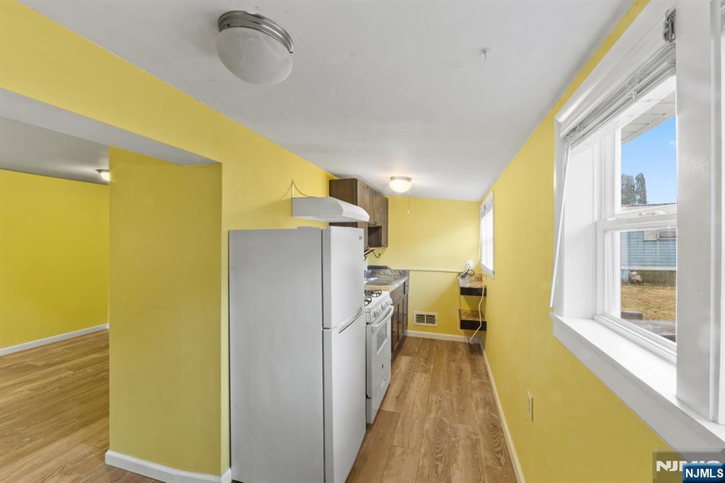 190 Highway 46, Unit B Little Ferry, NJ 07643 - Photo 6 of 20 a view of a kitchen with a refrigerator