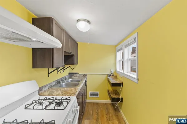a living room with a table and chairs