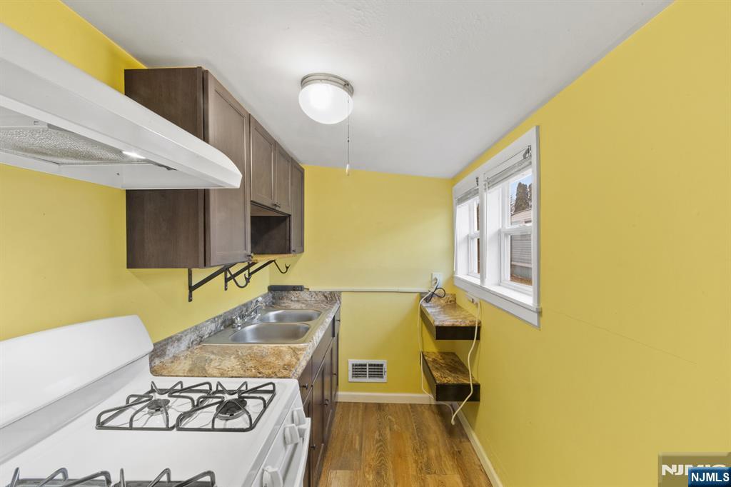 190 Highway 46, Unit B Little Ferry, NJ 07643 - Photo 7 of 20 a living room with a table and chairs