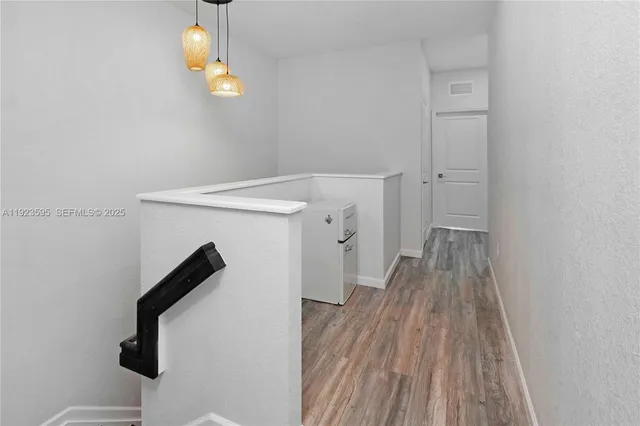 a view of entryway with wooden floor