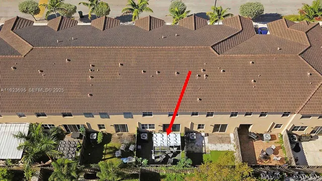 an aerial view of a building with outdoor space