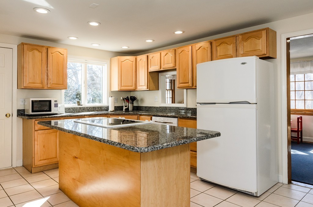 8 Circle Road Lexington, MA 02420 - Photo 2 of 10 a kitchen with stainless steel appliances granite countertop a refrigerator a stove a sink a microwave and a refrigerator