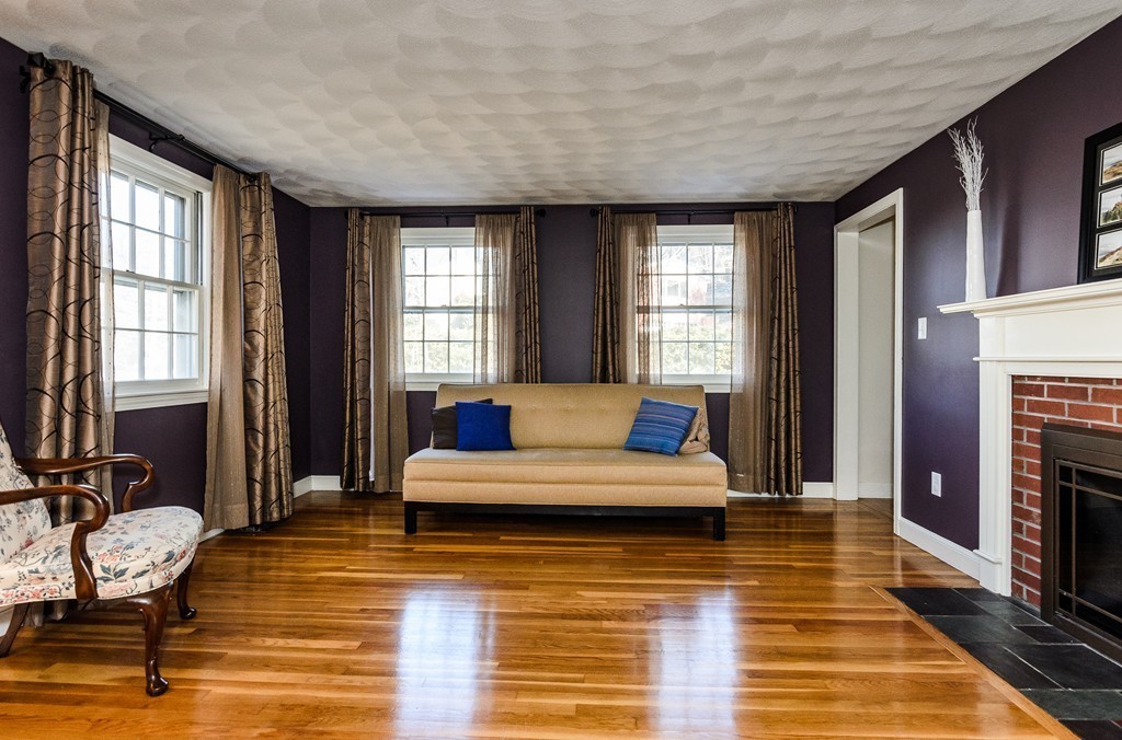 8 Circle Road Lexington, MA 02420 - Photo 4 of 10 a living room with furniture and a fireplace