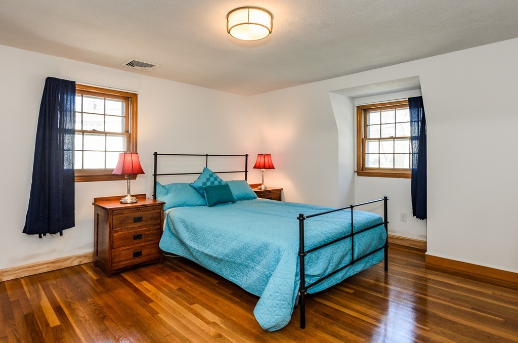 8 Circle Road Lexington, MA 02420 - Photo 7 of 10 a bedroom with a bed and wooden floor