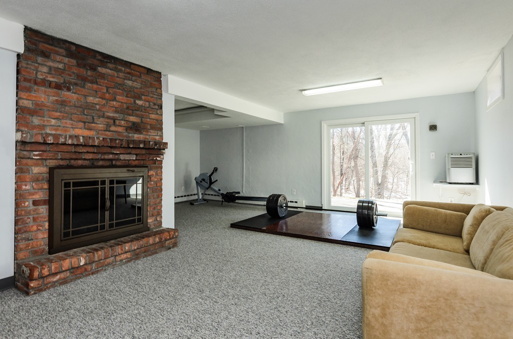 8 Circle Road Lexington, MA 02420 - Photo 9 of 10 a living room with furniture and a fireplace