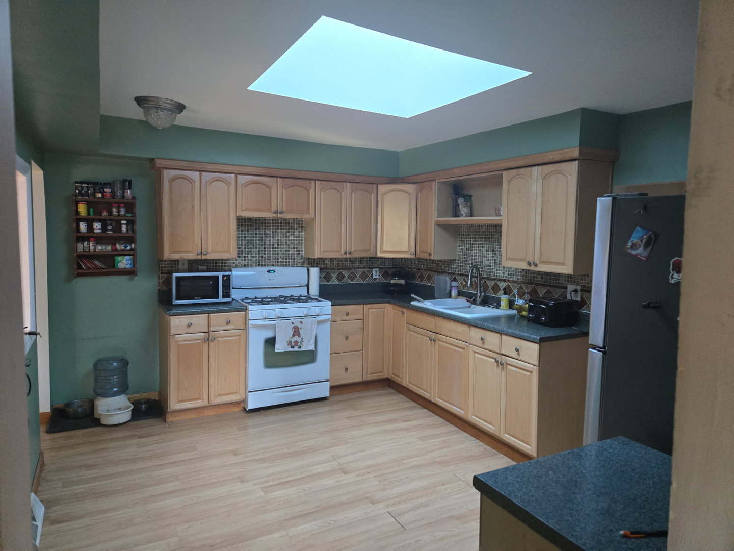 S732 Myrtle Street Winfield, IL 60190 - Photo 3 of 10 a kitchen with granite countertop a refrigerator stove top oven and sink