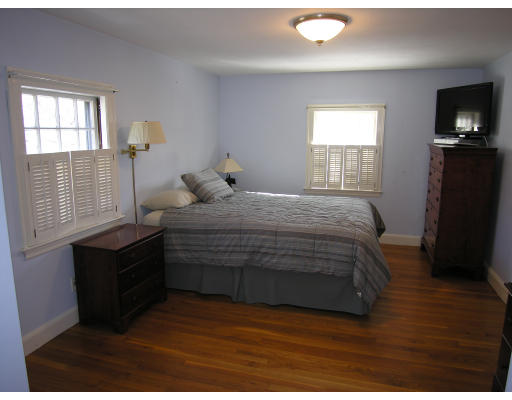 22 Mercer Road Needham, MA 02494 - Photo 9 of 25 a bedroom with a bed and a window