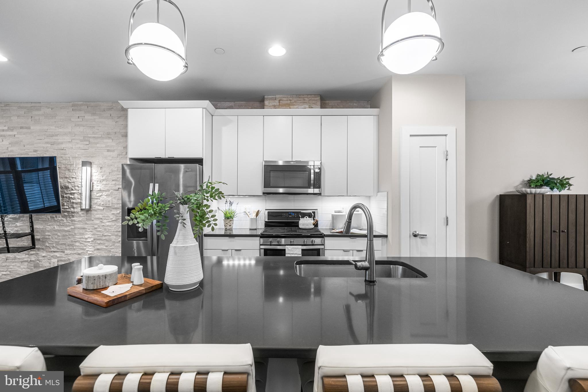 1600 Beason Street Baltimore, MD 21230 - Photo 20 of 53 a kitchen with sink refrigerator and microwave