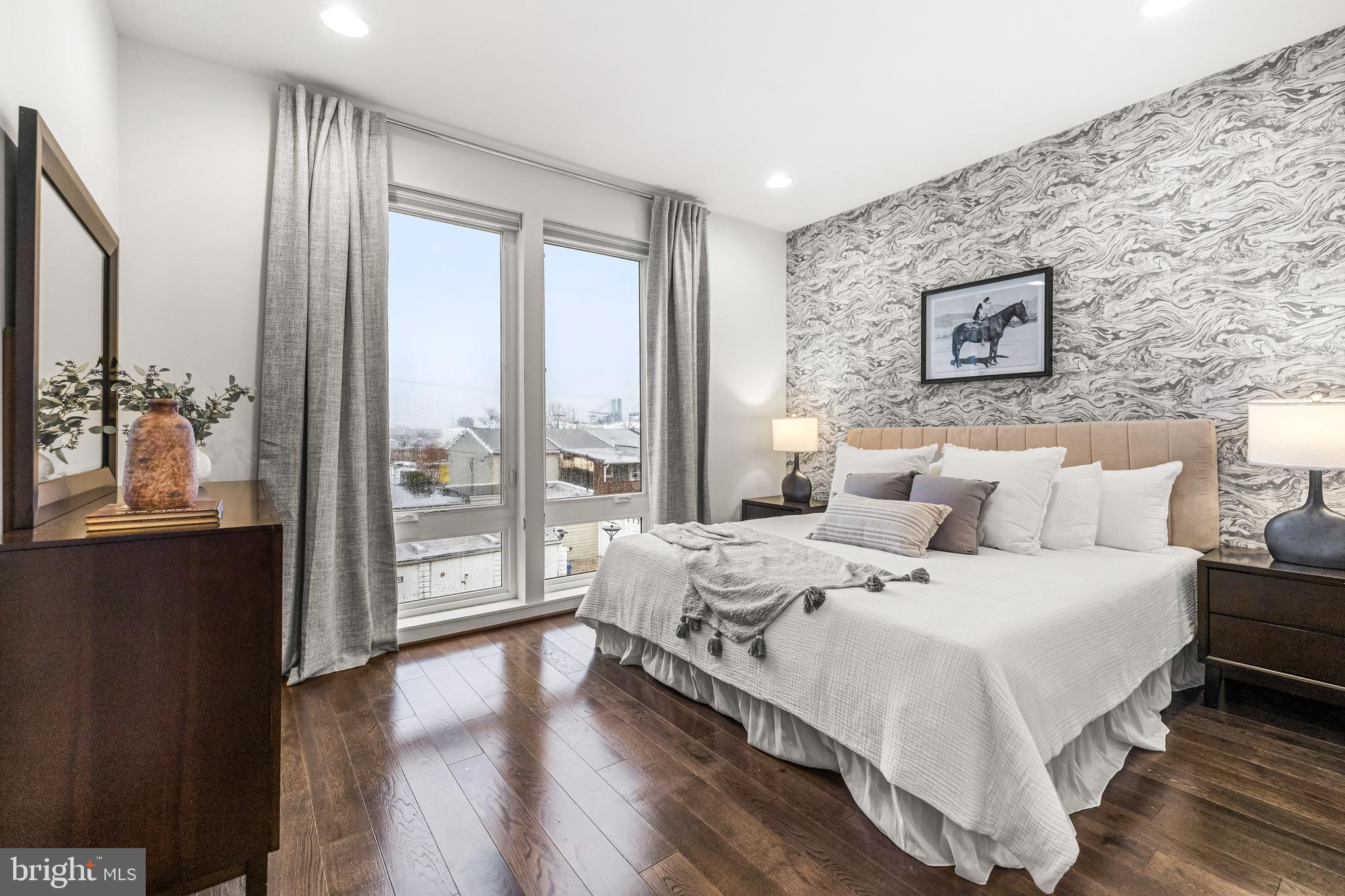 1600 Beason Street Baltimore, MD 21230 - Photo 27 of 53 a large bedroom with a bed and wooden floor