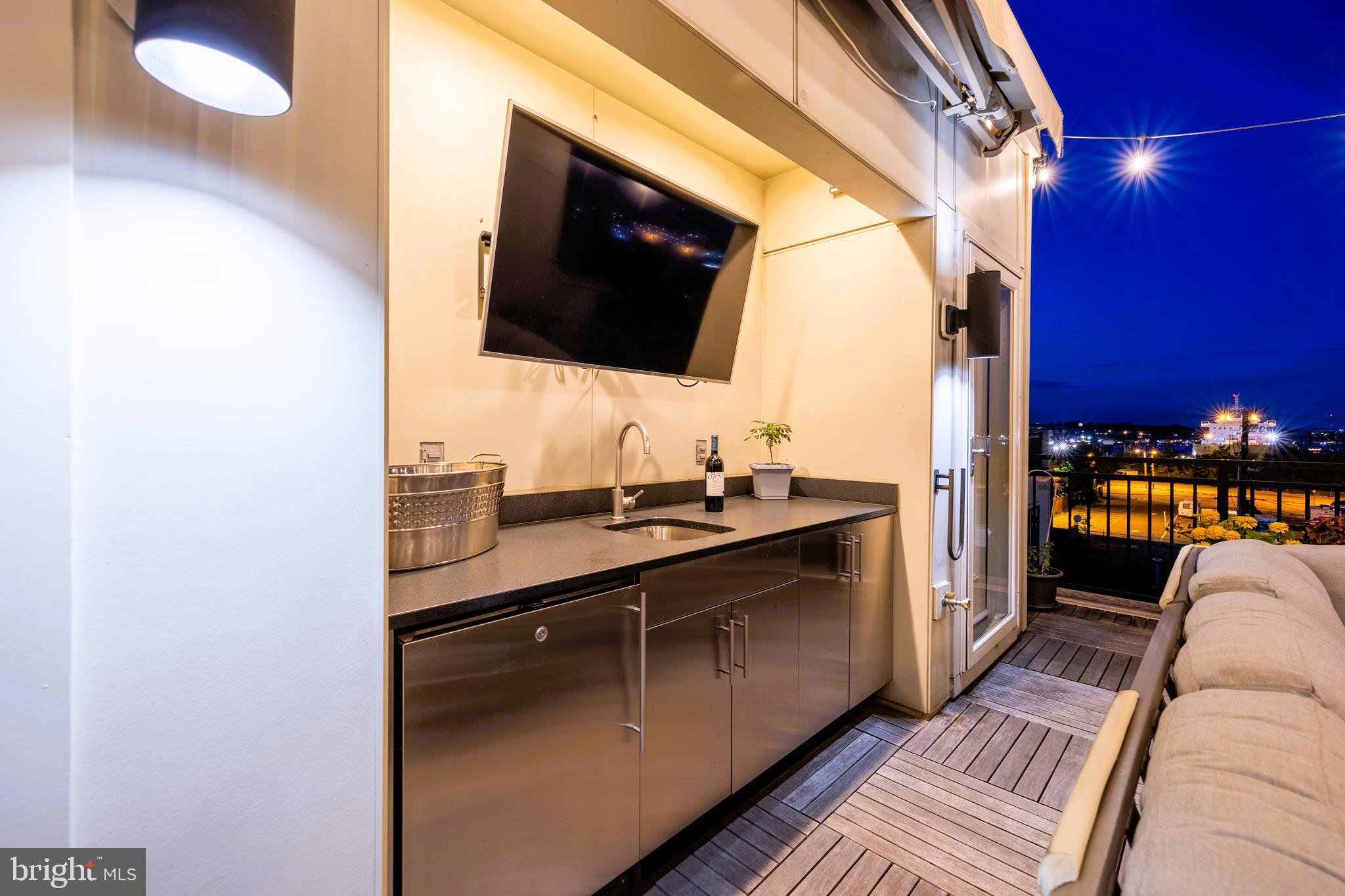 1600 Beason Street Baltimore, MD 21230 - Photo 45 of 53 a living room with stainless steel appliances furniture and a flat screen tv