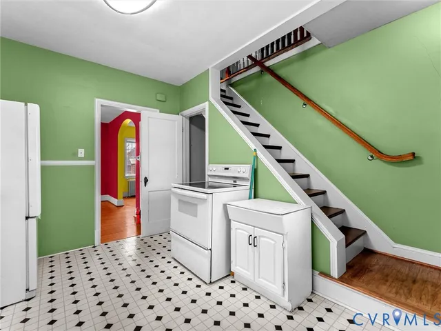 a room with cabinets and stairs