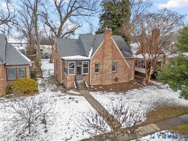 a view of a house with snow on the road