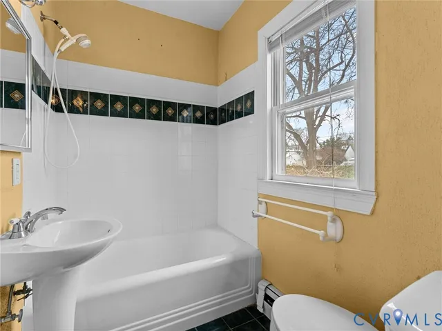 a bathroom with a sink and a bathtub