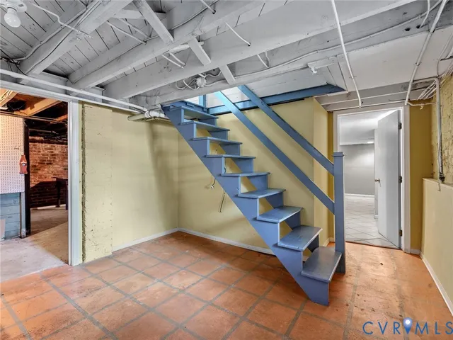 a utility room with cabinets dryer and washer