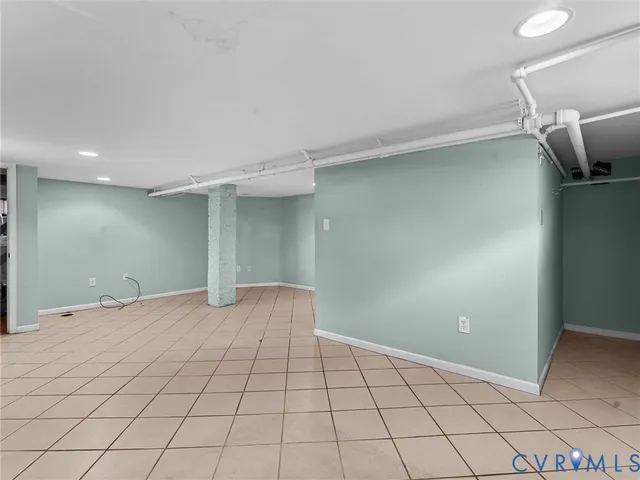 a bathroom with a sink a mirror and a shower