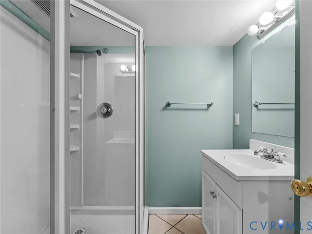 a view of a yard covered with snow in front of house