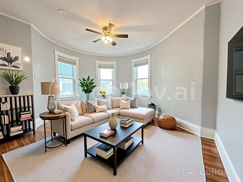 18 Harold Park, Unit 3 Boston, MA 02119 - Photo 5 of 41 a living room with furniture and a chandelier