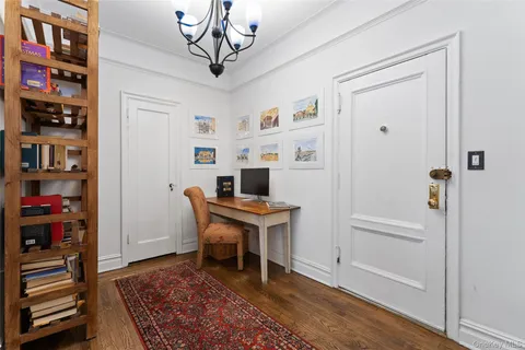 a view of a kitchen with wooden floor