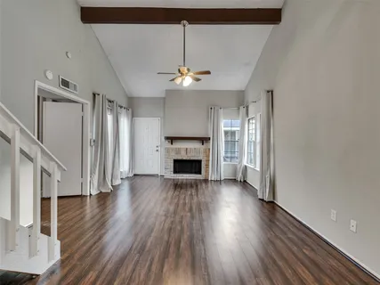 a kitchen with stainless steel appliances granite countertop a refrigerator a stove top oven a sink and dishwasher