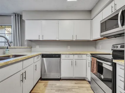 a view of a hallway with washer and dryer