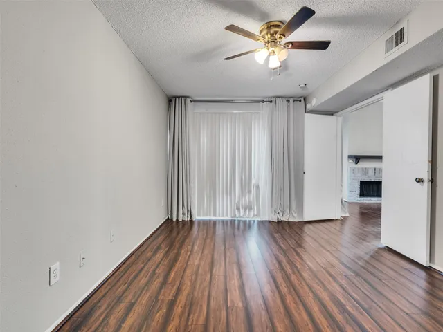 a bathroom with a granite countertop double vanity sink and mirror