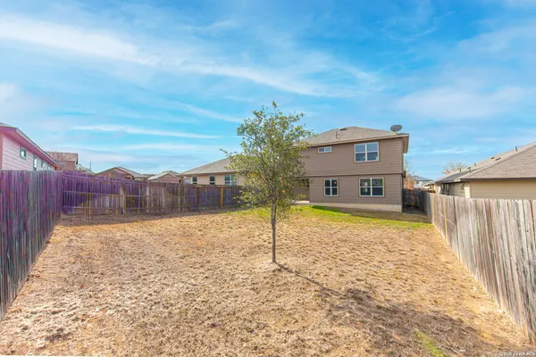a house view with a backyard space