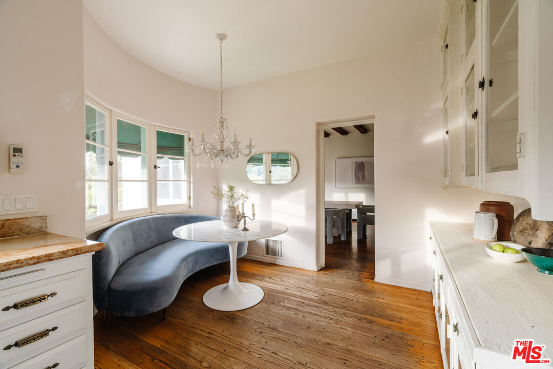 3131 Floye Drive Los Angeles, CA 90046 - Photo 13 of 53 a living room with furniture and a chandelier