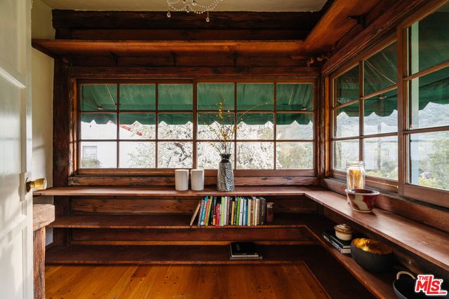 a view of a swimming pool and outdoor seating