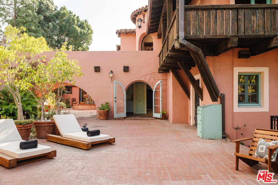 3131 Floye Drive Los Angeles, CA 90046 - Photo 2 of 53 a view of a patio with a table and chairs