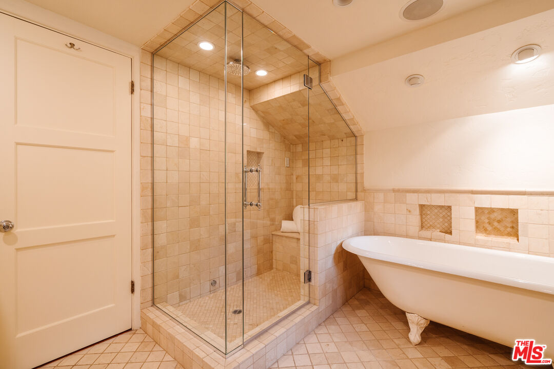 3131 Floye Drive Los Angeles, CA 90046 - Photo 28 of 53 a bathroom with a glass shower door and a sink
