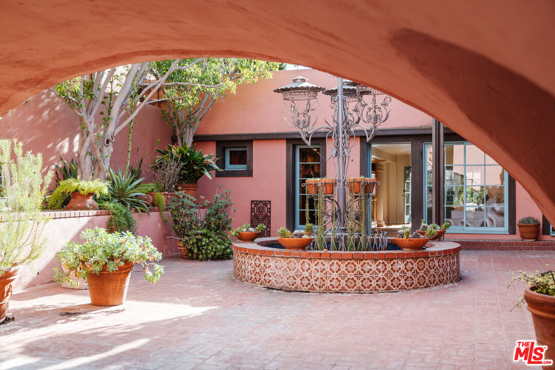 3131 Floye Drive Los Angeles, CA 90046 - Photo 35 of 53 a front view of a house with a garden