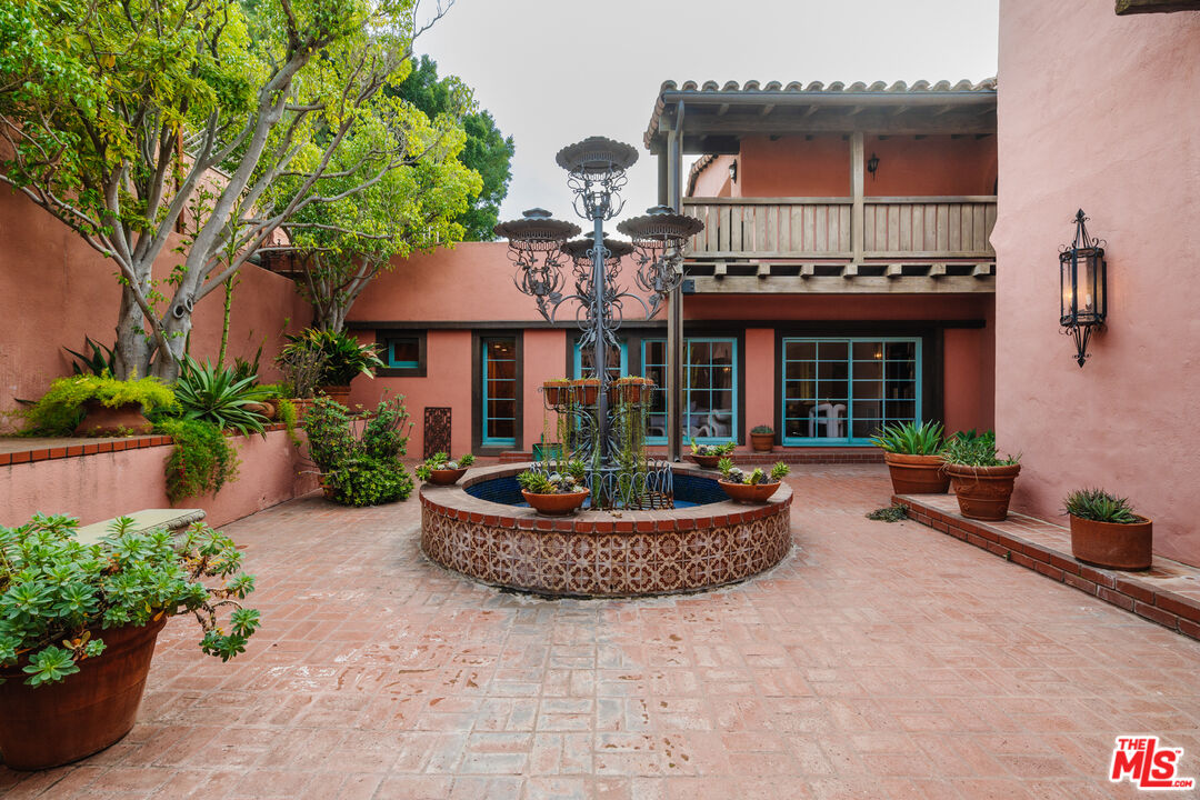 3131 Floye Drive Los Angeles, CA 90046 - Photo 36 of 53 a front view of a house with porch and plants