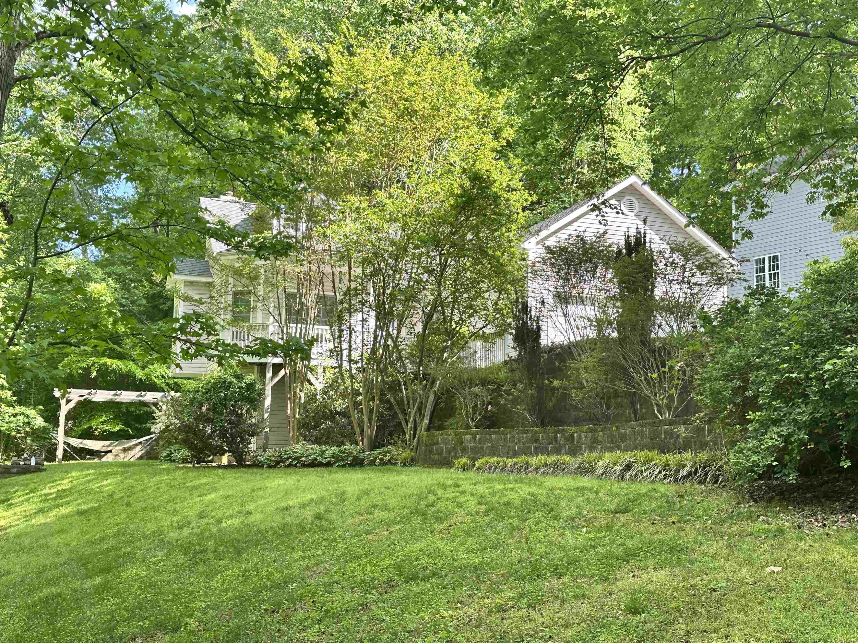 3801 Woodowl Drive Raleigh, NC 27613 - Photo 2 of 13 a backyard of a house with lots of green space
