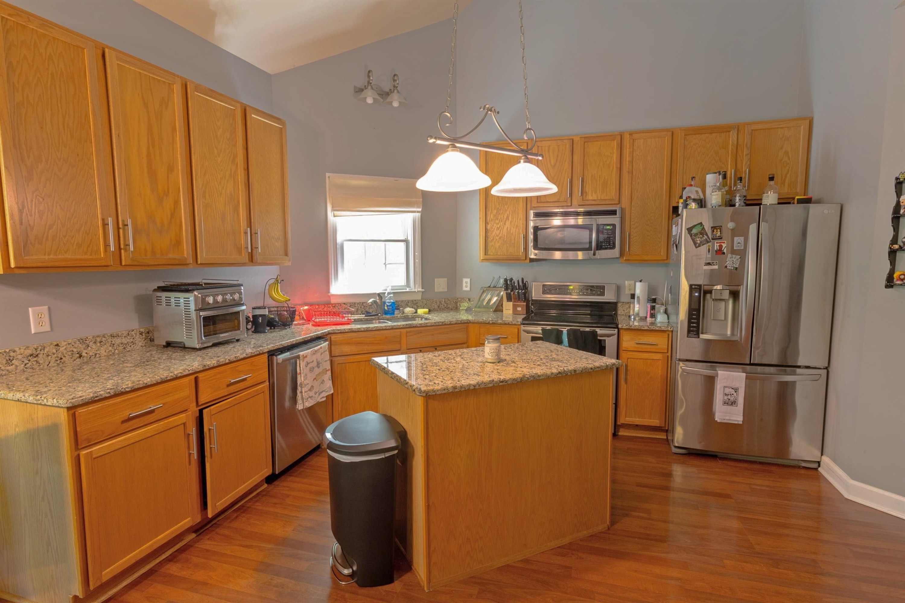3801 Woodowl Drive Raleigh, NC 27613 - Photo 6 of 13 a kitchen with a refrigerator sink and cabinets