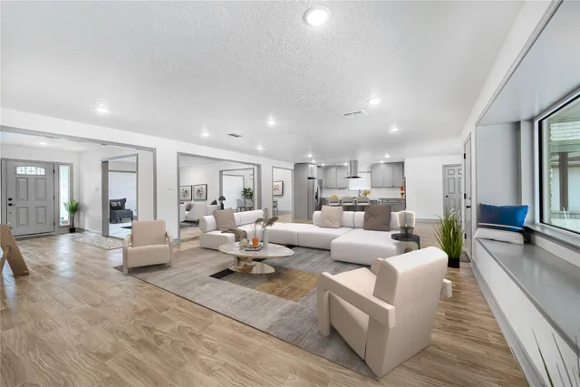 a living room with furniture or couch and a wooden floor