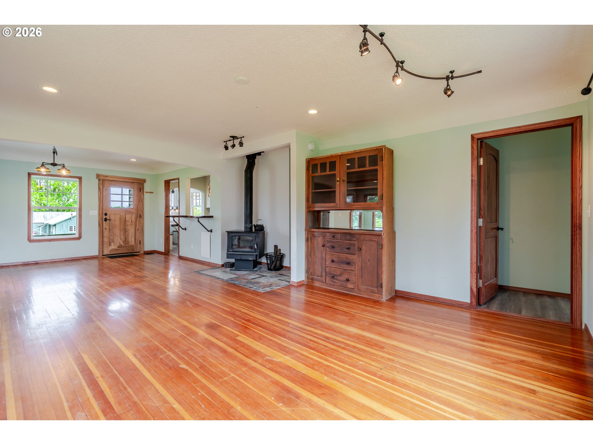 34965 Brewster Road Lebanon, OR 97355 - Photo 11 of 48 a view interior of a house with wooden floor and windows